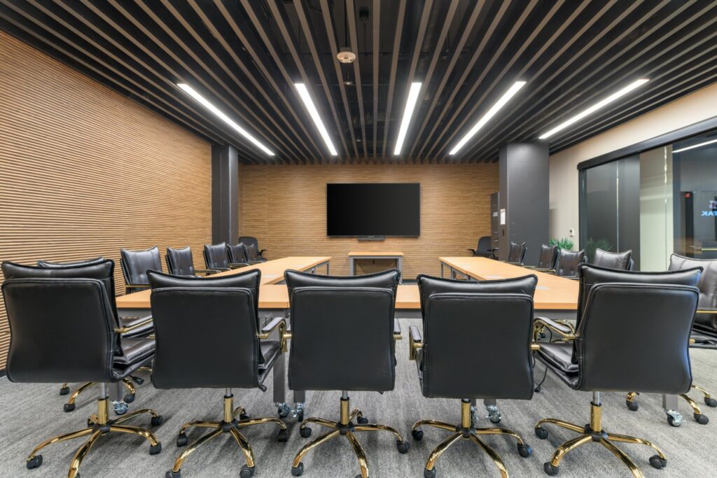 Boardroom with wood paneling at STAK Space, 1920 Broadway, Oakland