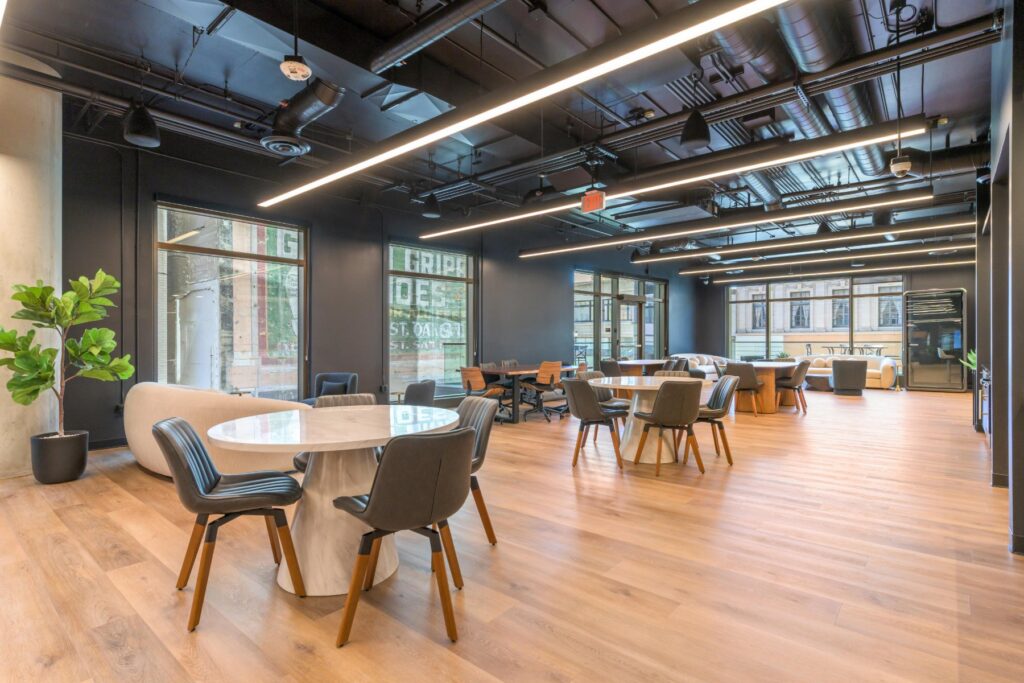 Cafe tables in the coworking space at STAK Space, 1920 Broadway, Oakland