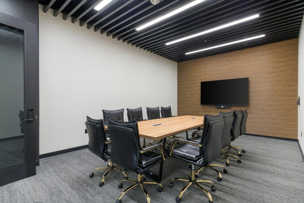 Conference room with display screen at STAK Space, 1920 Broadway, Oakland