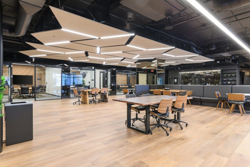 Coworking tables under statement lighting at STAK Space, 1920 Broadway, Oakland