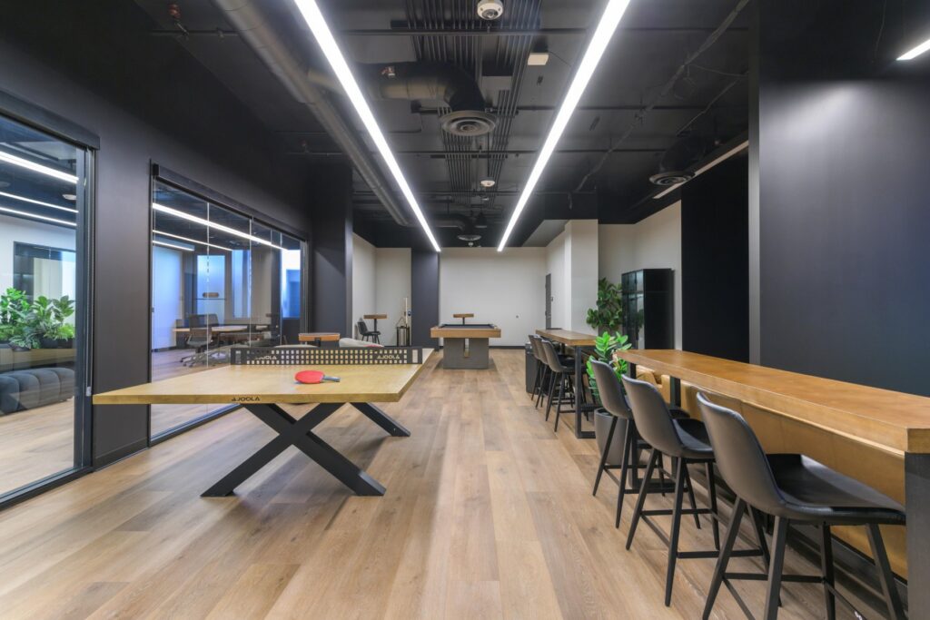 Lounge and communal table at STAK Space, 1920 Broadway, Oakland