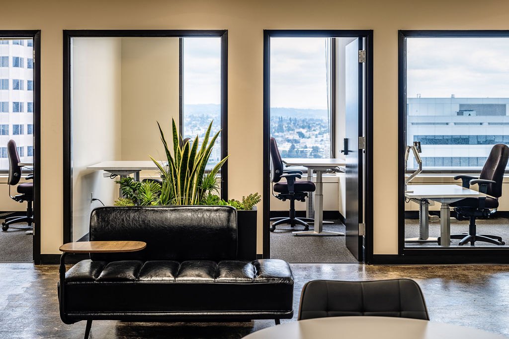Lounge seating by the windows at 1950 Franklin in Oakland