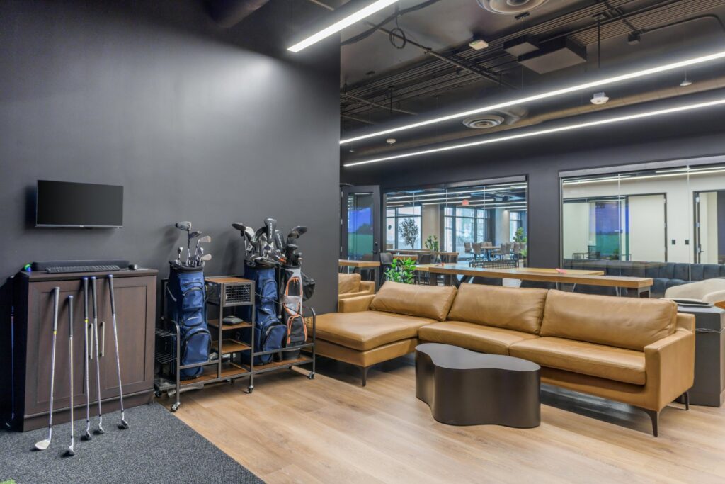 Members lounge with leather sofa at STAK Space, 1920 Broadway, Oakland