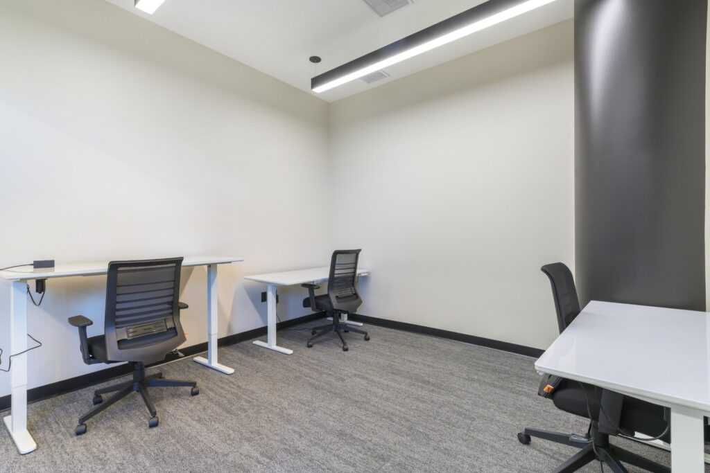 Private office with sit-stand desks at STAK Space, 1920 Broadway, Oakland