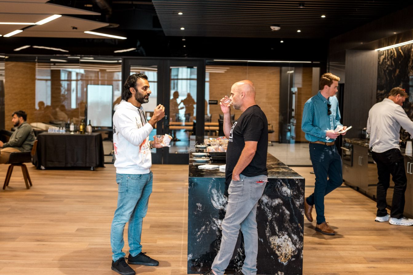 Founders talking over drinks at the STAK bar