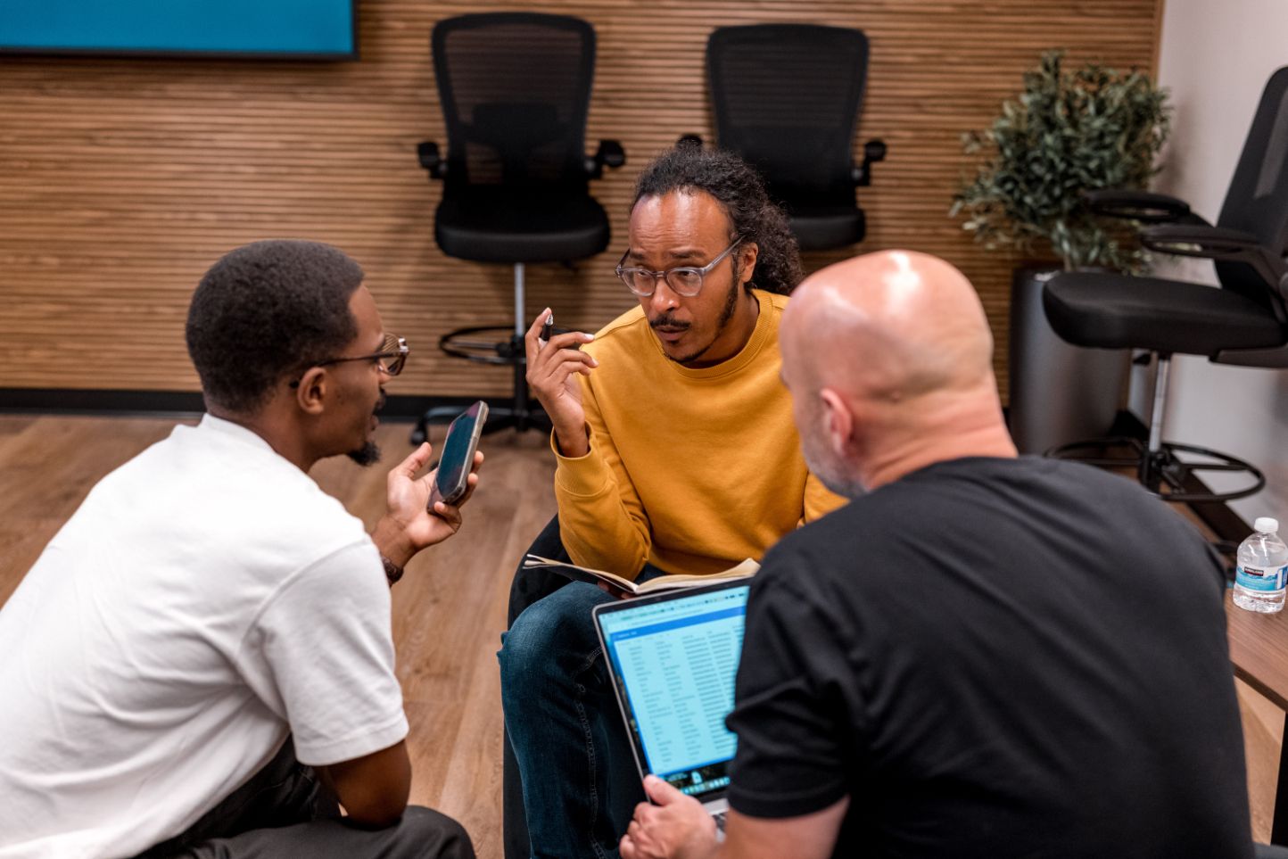 Founders working through a plan together on a laptop at STAK