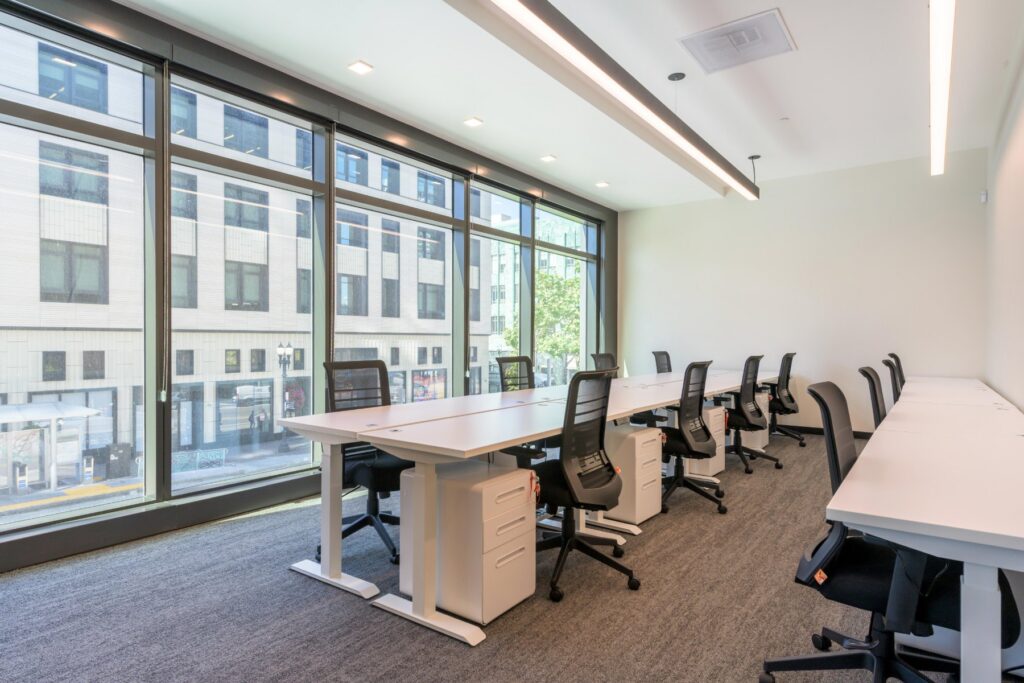 Team office with desks by the windows at STAK Space, 1920 Broadway, Oakland
