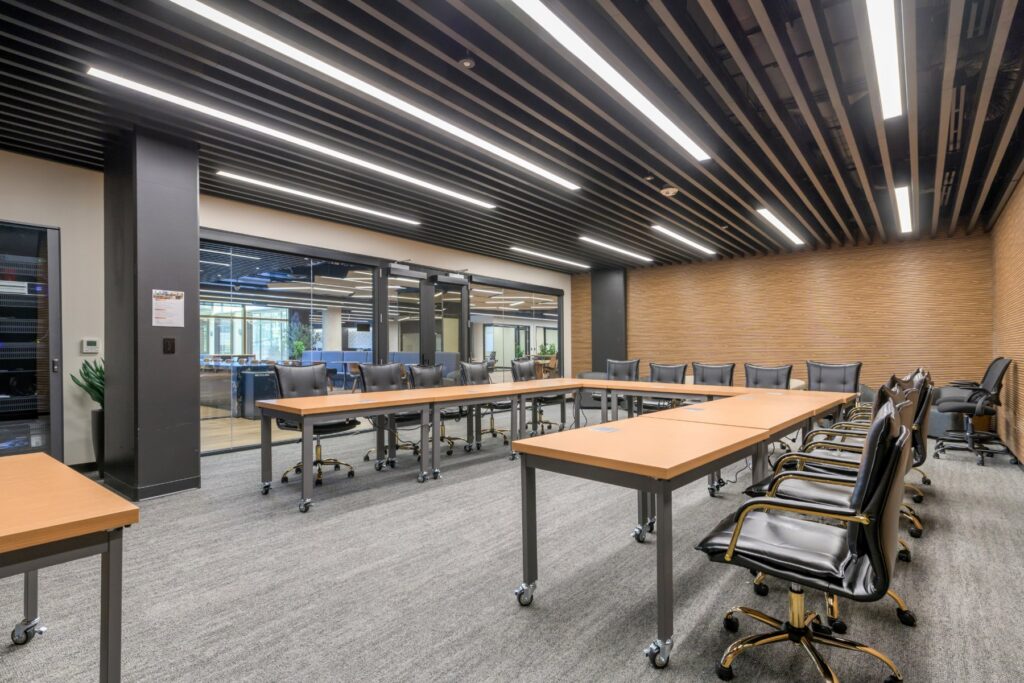 Training room with work tables at STAK Space, 1920 Broadway, Oakland